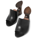La Sculpture black leather wedge mules