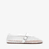 White woven flat shoe on a white background
