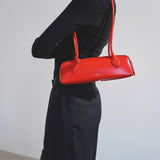 Le Teckel small red leather bag