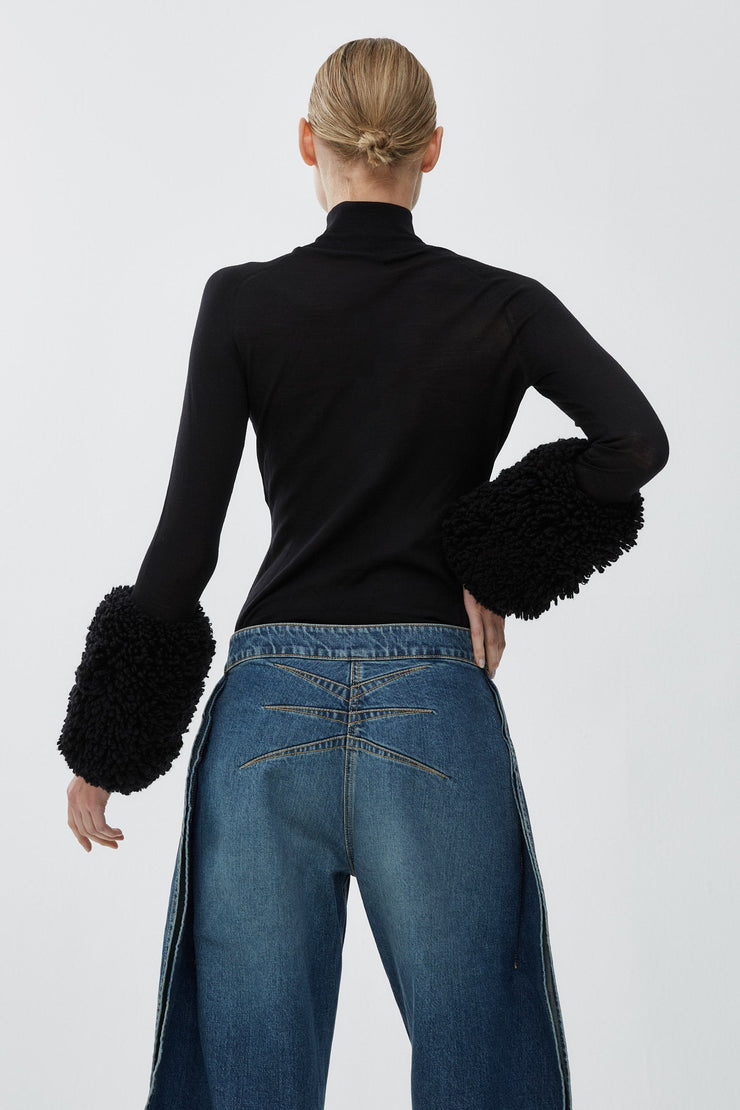 Faux fur sleeved knit top