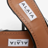 Coeur abstrait patent leather mules