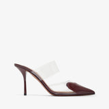 High-heeled shoe with clear strap on a white background