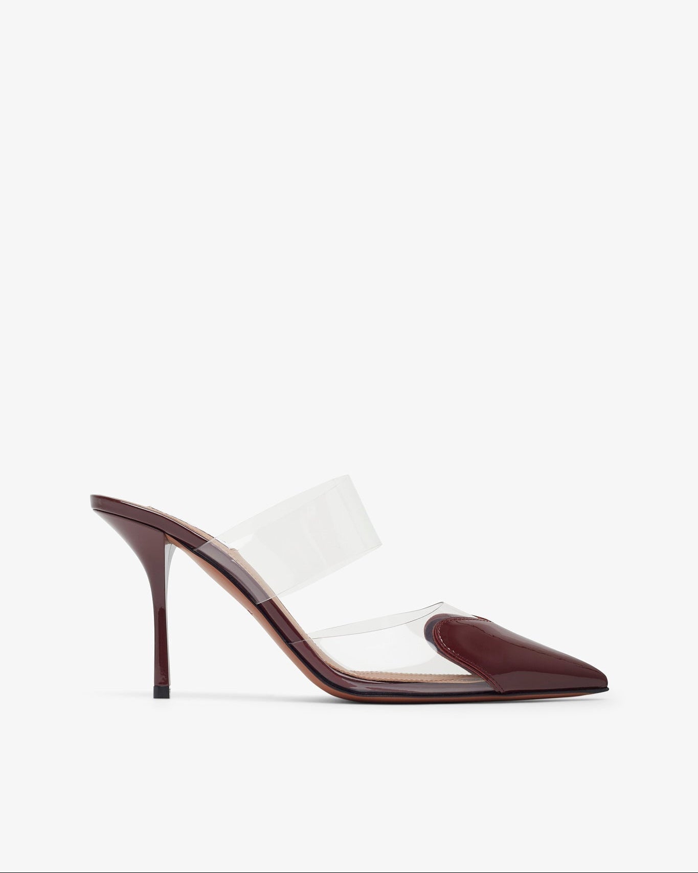 High-heeled shoe with clear strap on a white background