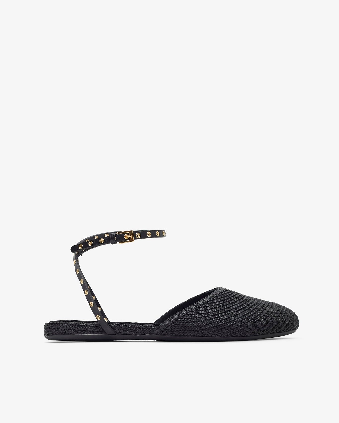 Black flat sandal with studded detail on a white background