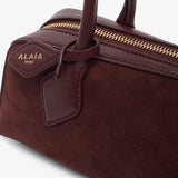 Le Teckel small dark red bag