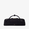 Black handbag with gold accents on a white background