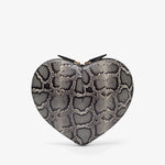 Heart-shaped clutch with snake skin pattern on a white background