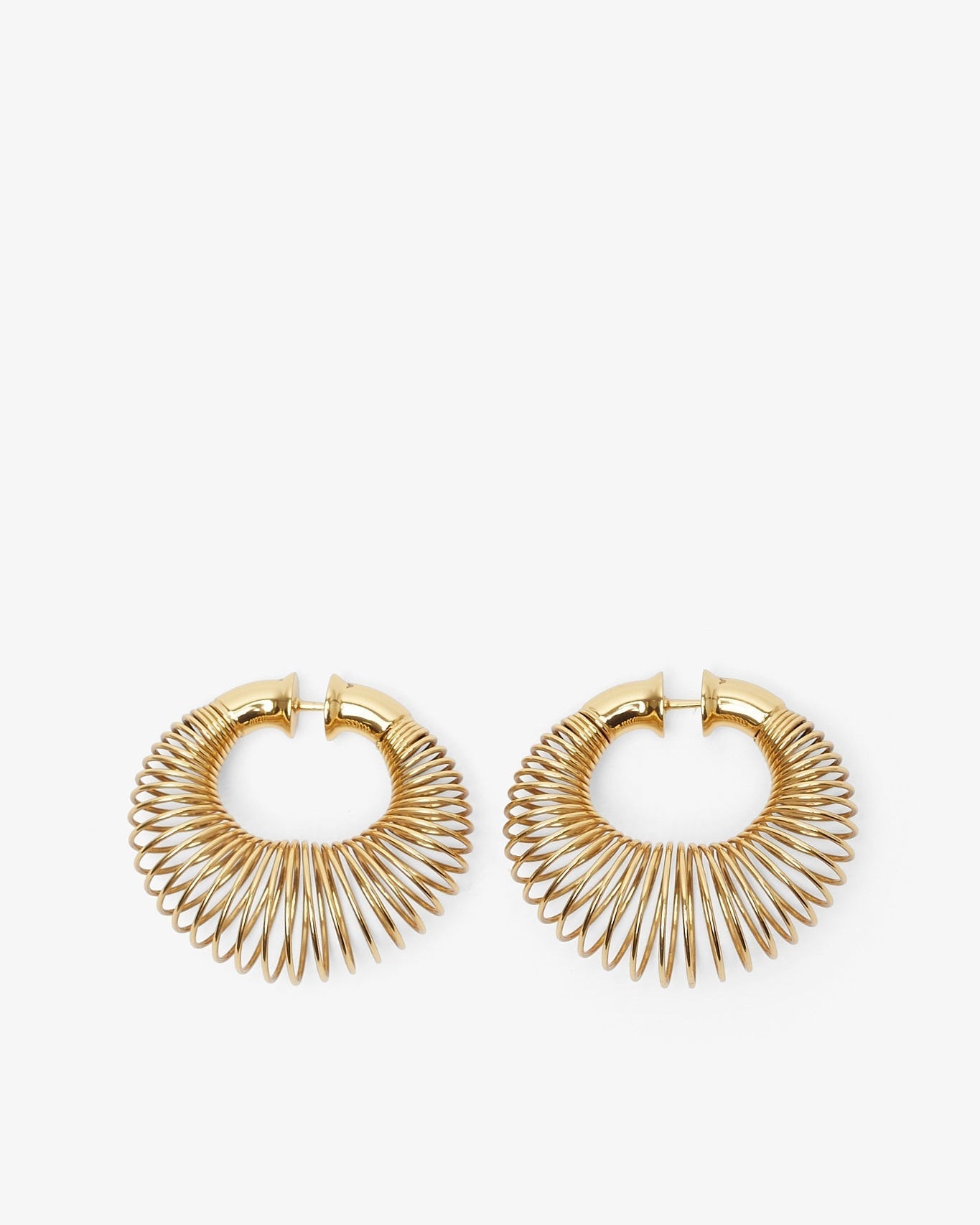 Gold hoop earrings on a white background