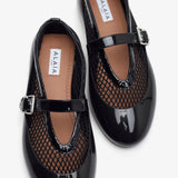 Black rubber ballet flats