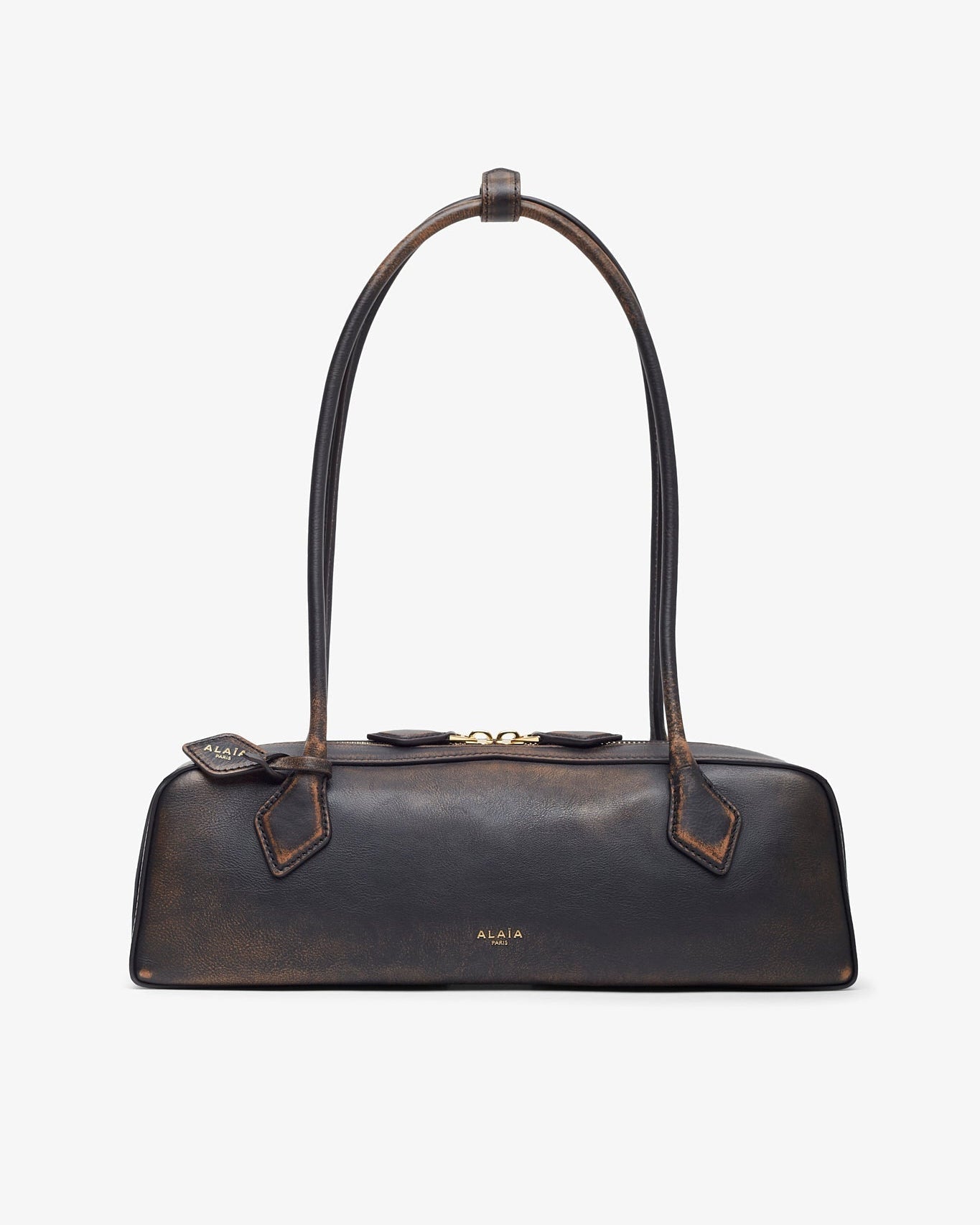 Brown leather handbag with a bow detail on a white background