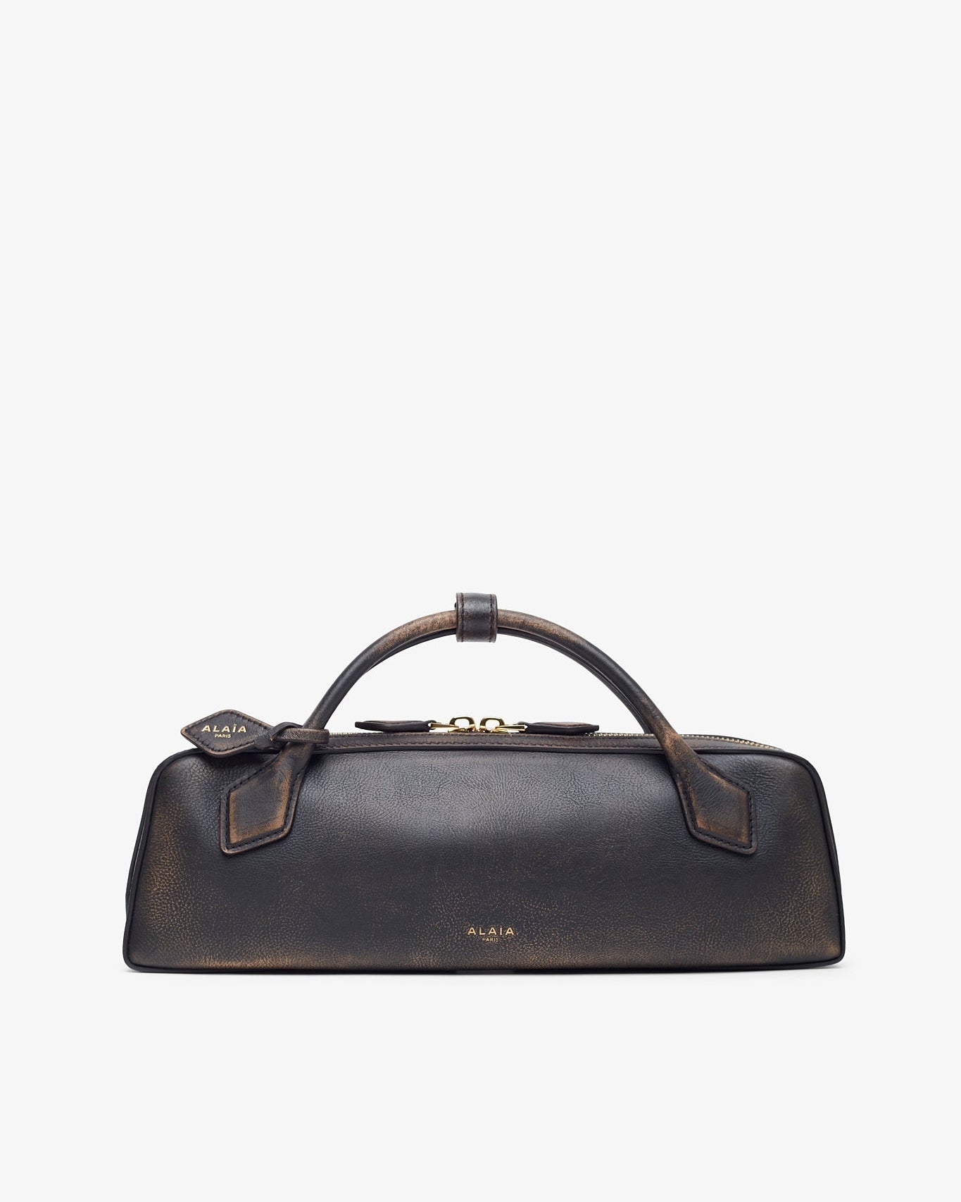 Black leather handbag with gold accents on a light gray background