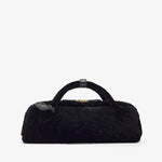 Black fur bag with a tag on a white background