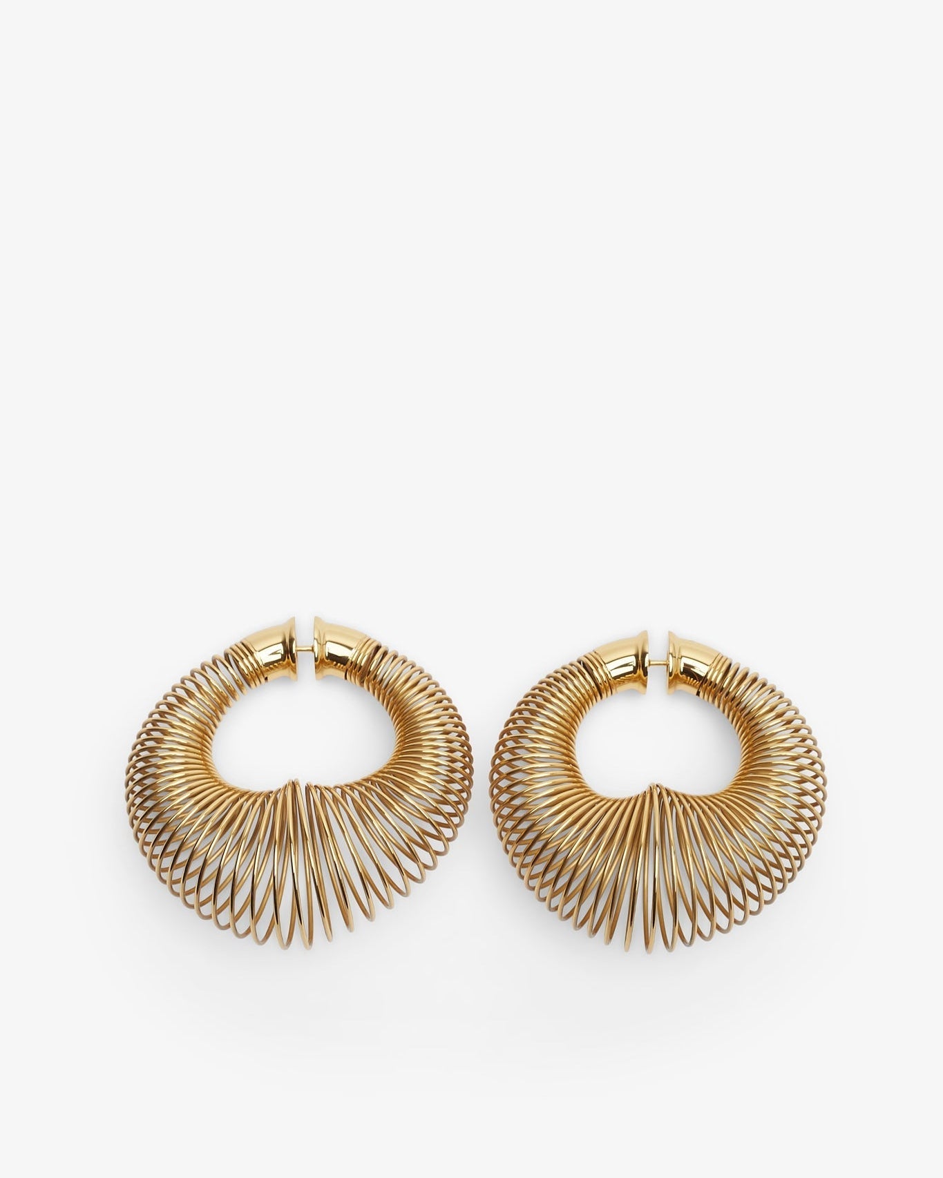 Pair of gold hoop earrings on a white background