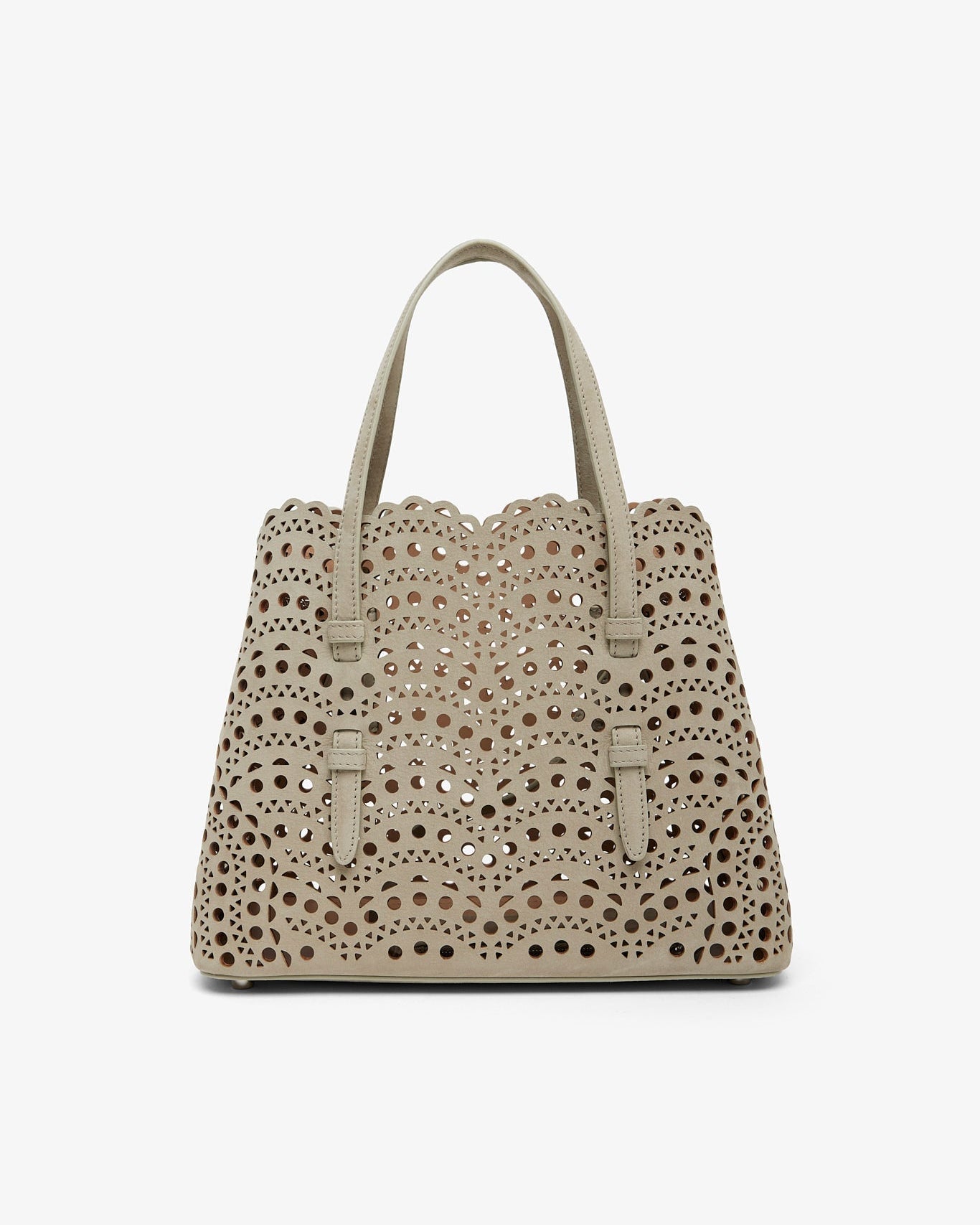 Beige handbag with decorative studs on a white background