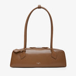 Brown handbag on a light beige background