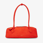 Red handbag with a bow detail on a white background