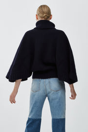 Short dark blue turtleneck cape