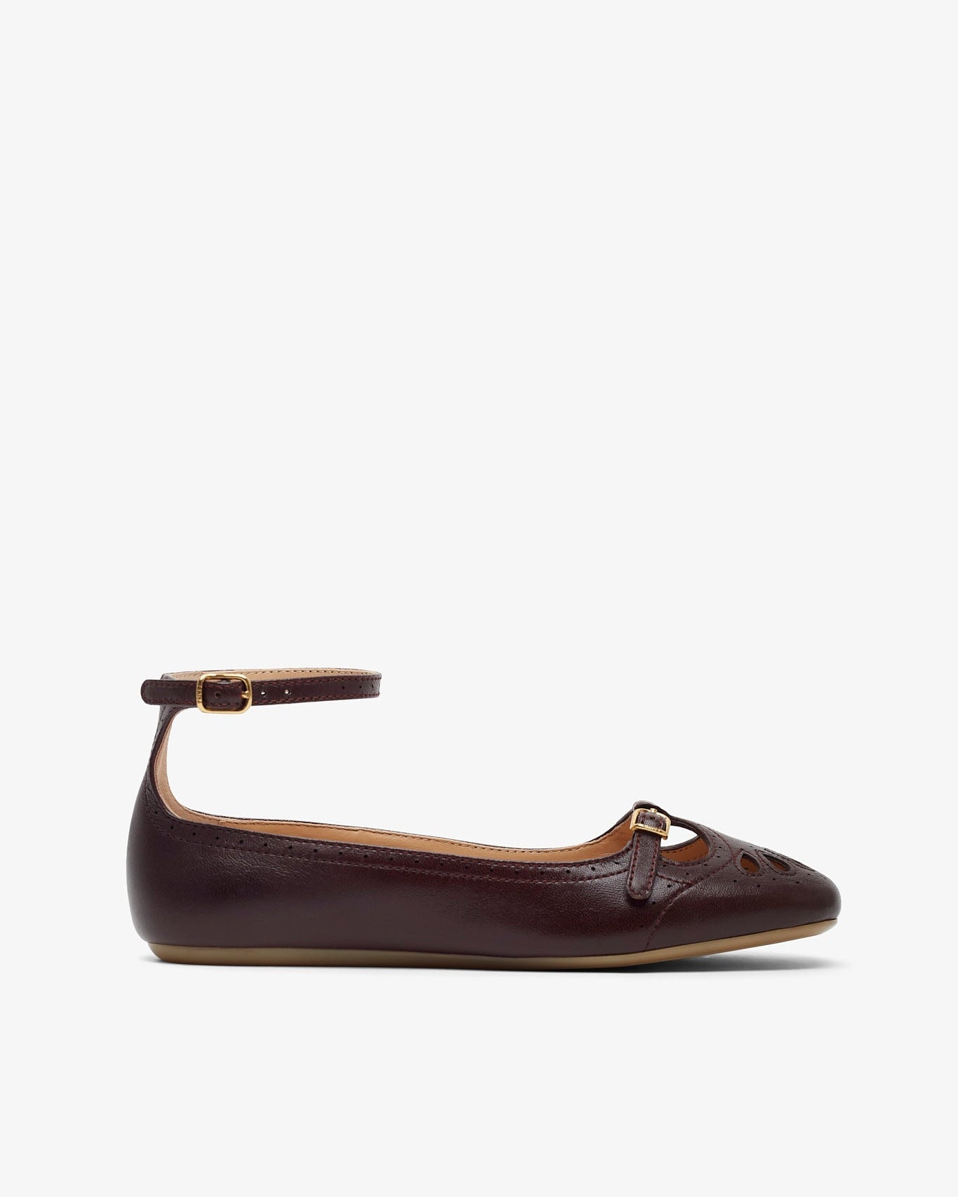 Brown leather flat shoe with a strap on a white background