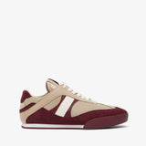 Beige and burgundy sneaker on a white background