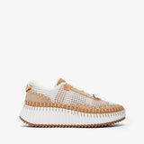 Sneaker with white sole and beige mesh upper on a white background