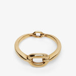 Gold chain-style ring on a white background