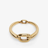 Gold chain-style ring on a white background