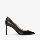 Black high-heeled shoe on a light gray background