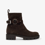 Brown suede boot with a buckle on a white background