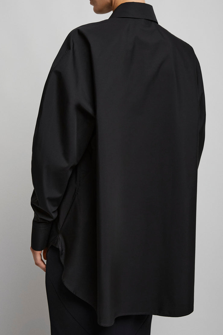 Cocoon black shirt with turned sleeves