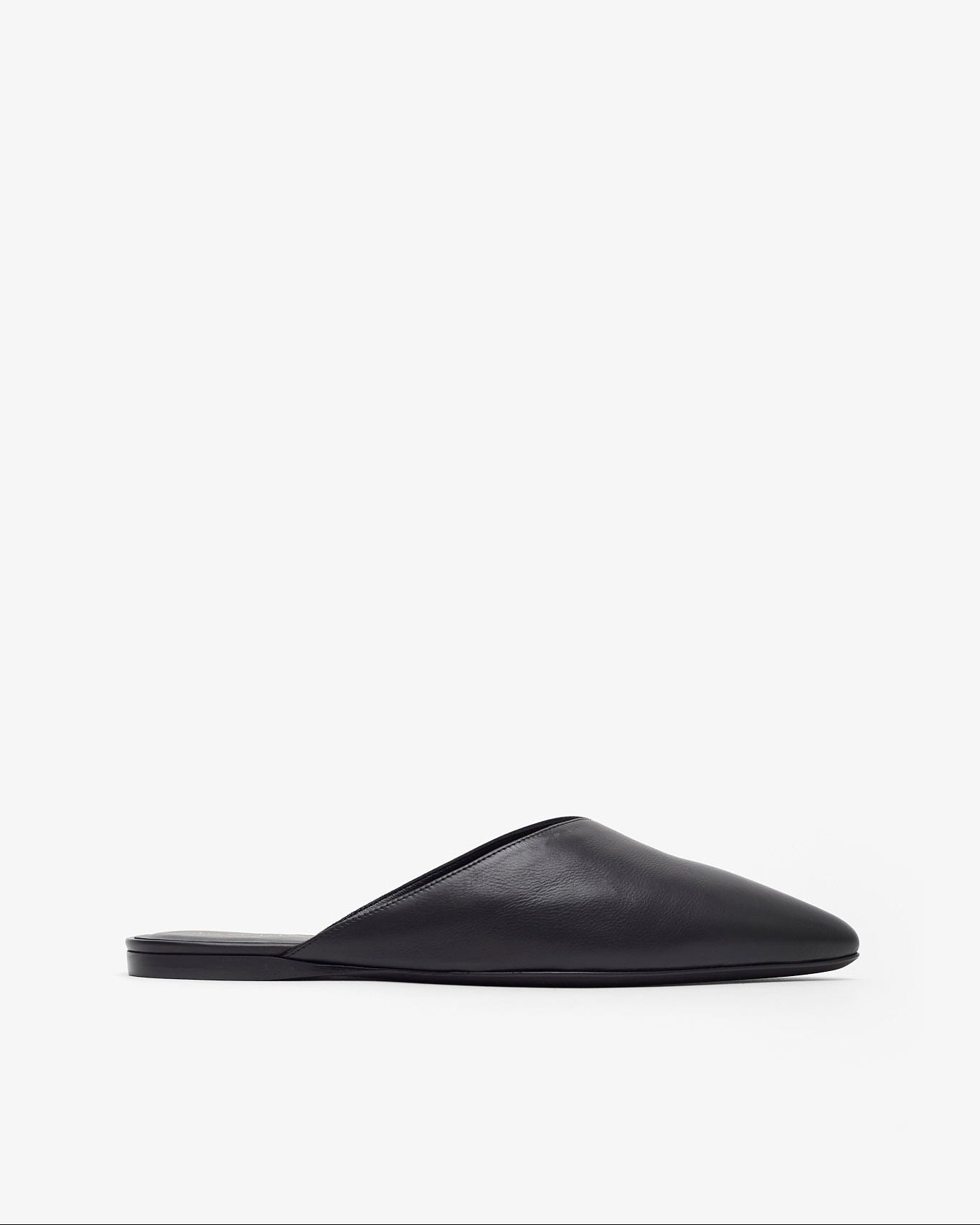 Black slip-on shoe on a white background