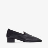 Black leather shoe on a white background