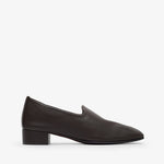 Black loafer shoe on a white background