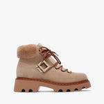 Beige boot with fur lining on a white background