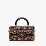 Leopard print handbag with black handle and hardware on a white background