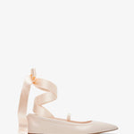 Beige ballerina shoes with ribbon straps on a white background