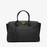 Black handbag with gold accents on a white background
