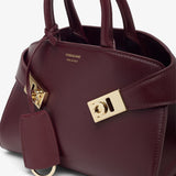 Hug mini soft plum top handle bag