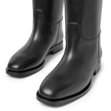 Grunge riding black leather boots