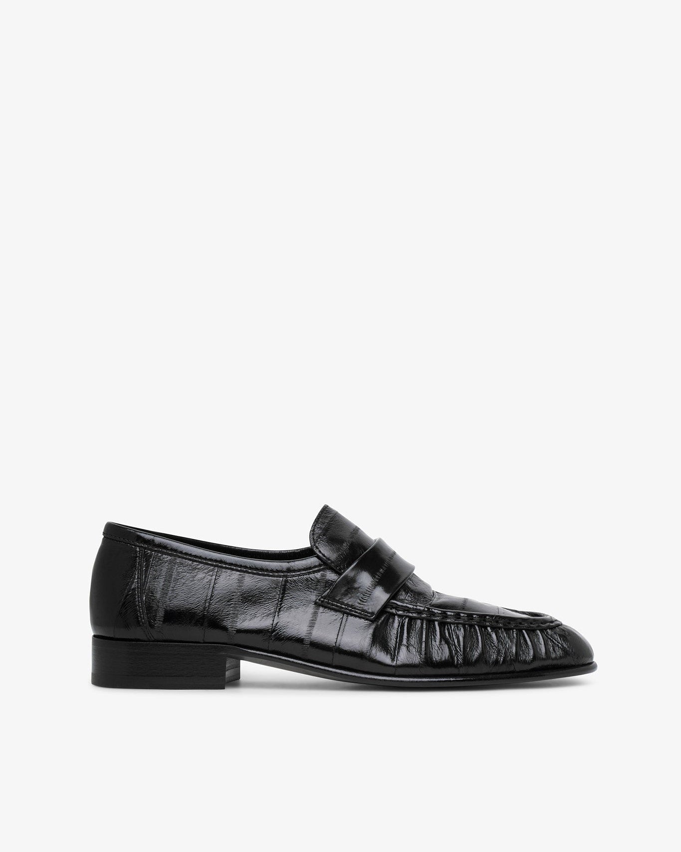 Black leather loafer on a white background