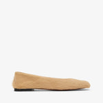 Beige sock with a black sole on a white background