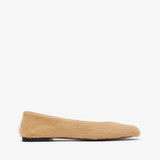 Beige sock with a black sole on a white background