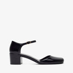 Black patent leather shoe on a white background