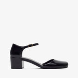 Black patent leather shoe on a white background