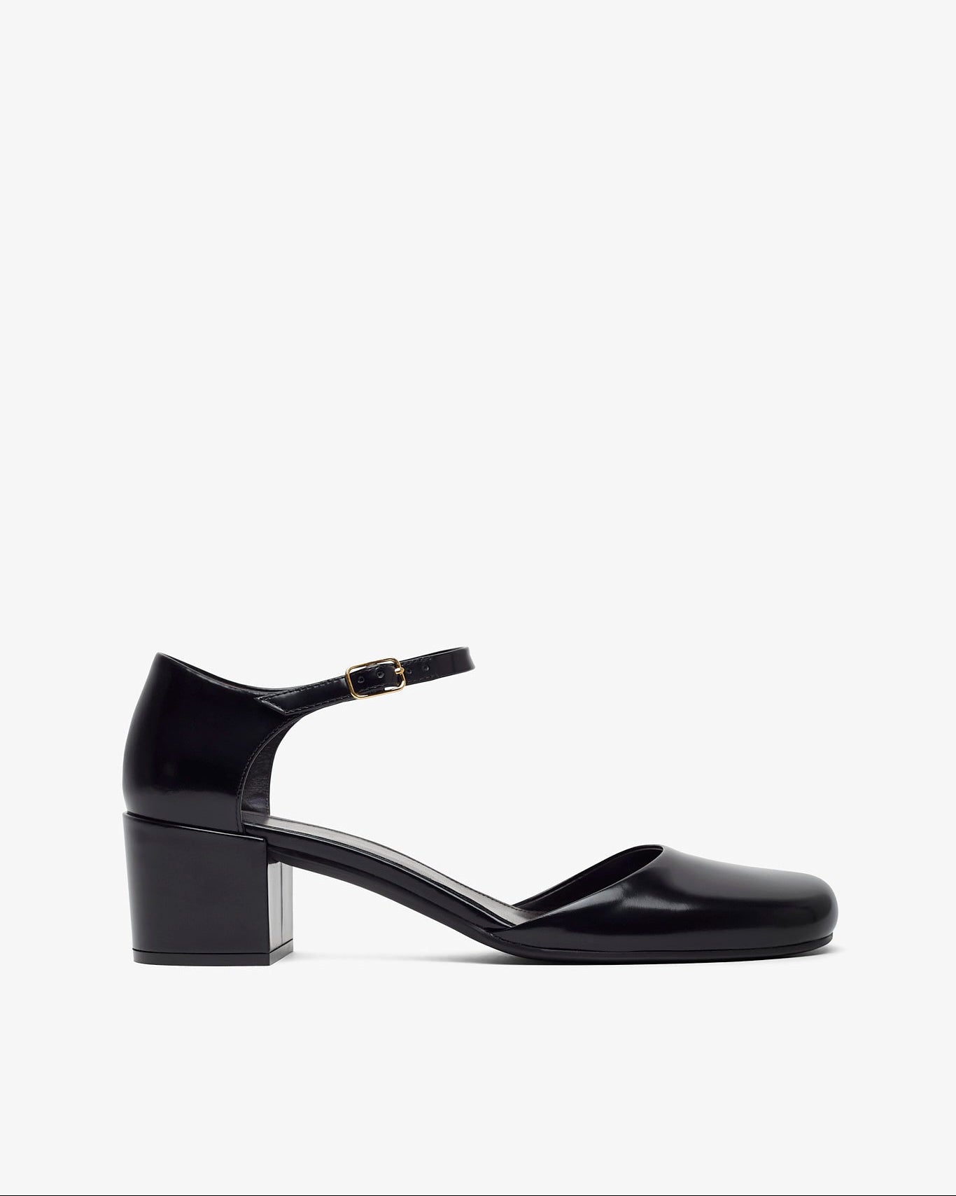 Black patent leather shoe on a white background