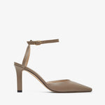 Beige high-heeled shoe with a thin strap on a white background