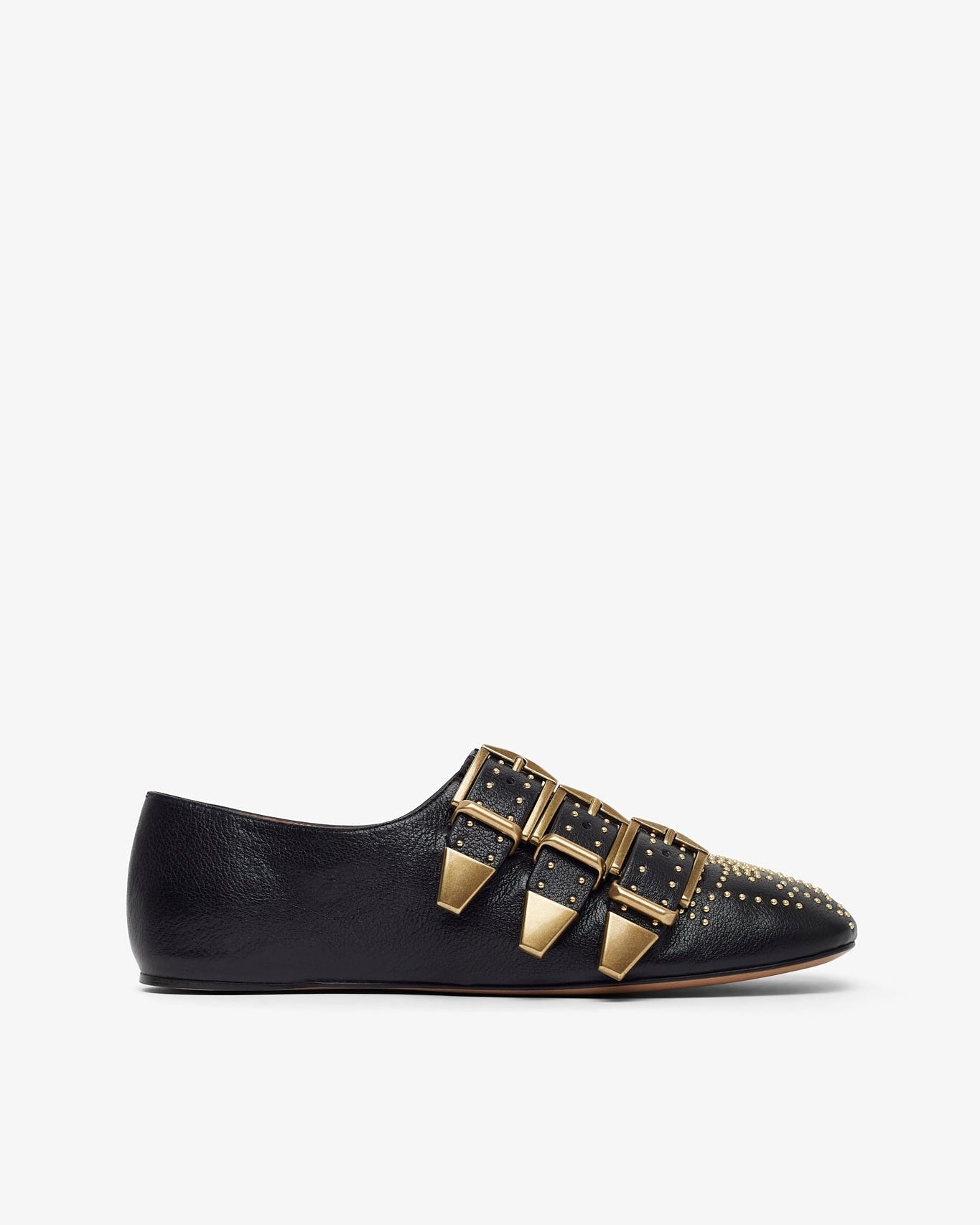 Black flat shoe with gold buckles on a white background