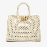 Woven handbag with a gold clasp on a white background
